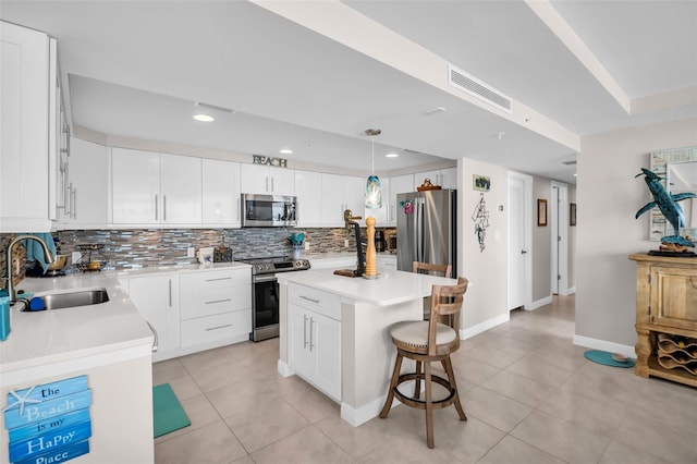 223 Island Way Unit 7F, Clearwater Beach, FL 33767 - kitchen with appliances with stainless steel finishes, a sink, tasteful backsplash, light tile patterned flooring, and recessed lighting
