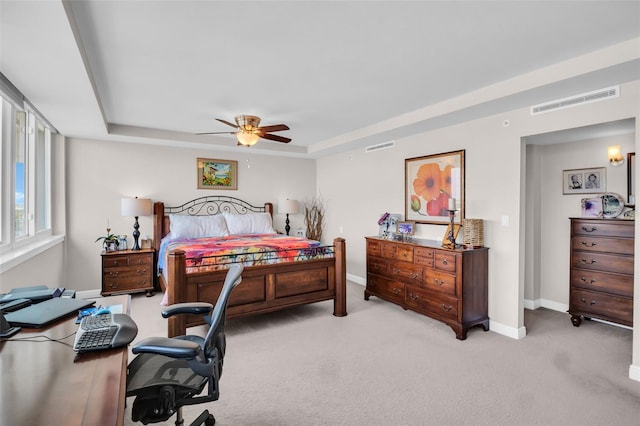 223 Island Way Unit 7F, Clearwater Beach, FL 33767 - bedroom featuring light carpet, a raised ceiling, baseboards, and a ceiling fan
