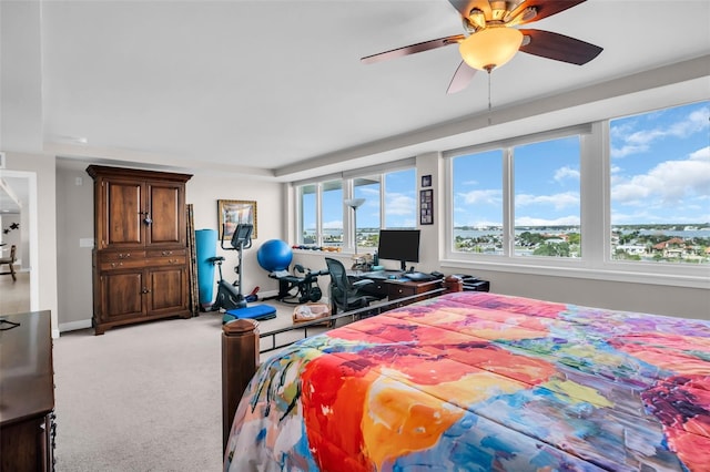 223 Island Way Unit 7F, Clearwater Beach, FL 33767 - bedroom featuring light colored carpet, baseboards, and ceiling fan