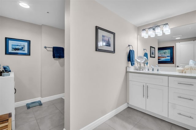223 Island Way Unit 7F, Clearwater Beach, FL 33767 - bathroom featuring vanity, baseboards, and tile patterned flooring