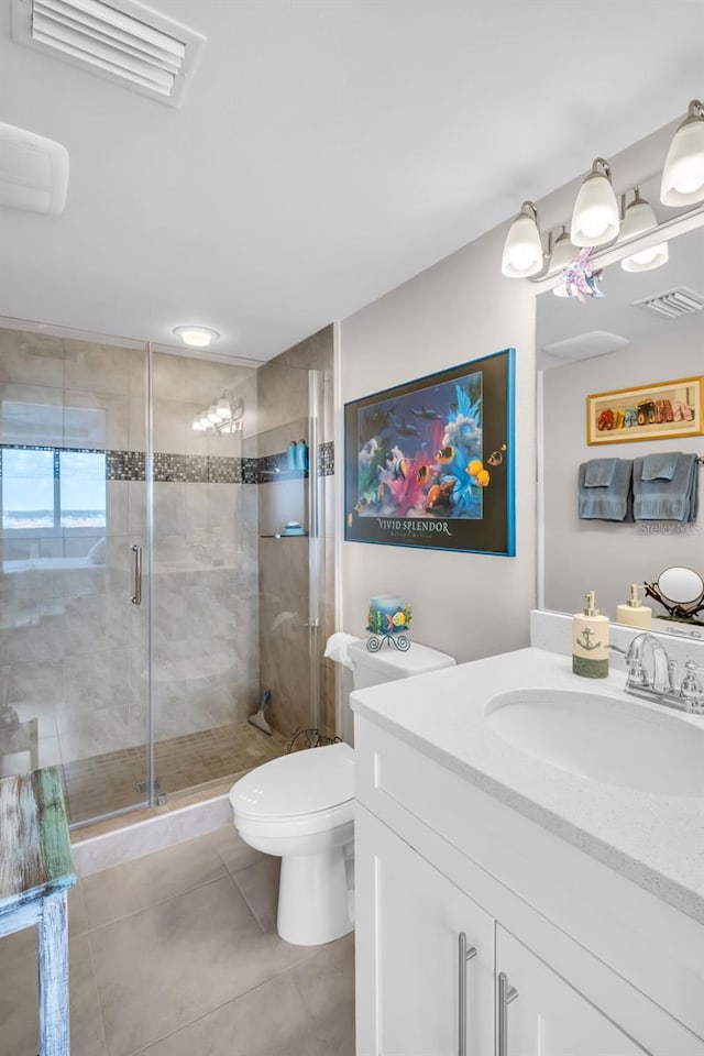 223 Island Way Unit 7F, Clearwater Beach, FL 33767 - full bath featuring vanity, tile patterned floors, toilet, and a shower stall