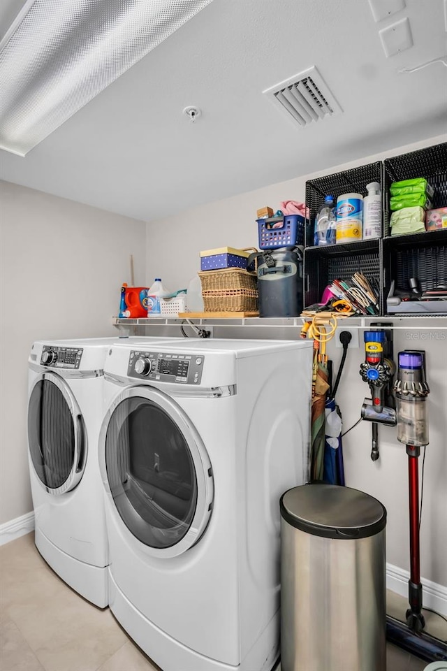 223 Island Way Unit 7F, Clearwater Beach, FL 33767 - laundry room with independent washer and dryer and baseboards