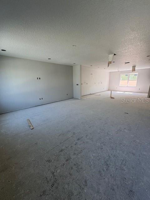 4208 W Carmen St Unit C, Tampa, FL 33609 - unfurnished room featuring a textured ceiling