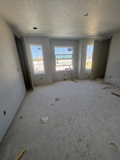 4208 W Carmen St Unit C, Tampa, FL 33609 - empty room with a textured ceiling