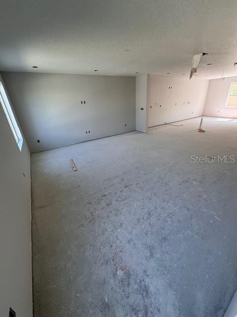 4208 W Carmen St Unit C, Tampa, FL 33609 - unfurnished room featuring a textured ceiling
