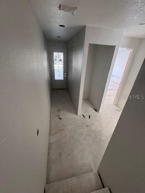 4208 W Carmen St Unit C, Tampa, FL 33609 - stairway featuring a textured ceiling