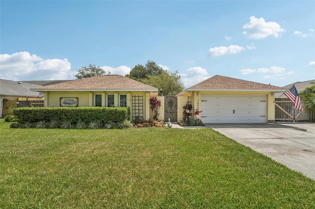 15005 Roundup Dr, Tampa, FL 33624 - ranch-style house with driveway and an attached garage
