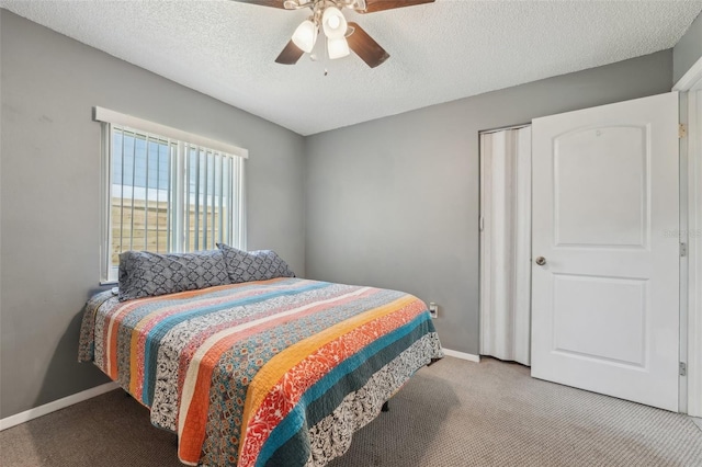 15005 Roundup Dr, Tampa, FL 33624 - carpeted bedroom with baseboards, a textured ceiling, and a ceiling fan