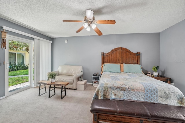 15005 Roundup Dr, Tampa, FL 33624 - carpeted bedroom featuring access to exterior, a textured ceiling, and ceiling fan