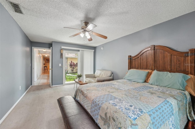 15005 Roundup Dr, Tampa, FL 33624 - bedroom with light carpet, baseboards, a ceiling fan, and a textured ceiling