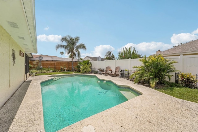 15005 Roundup Dr, Tampa, FL 33624 - view of swimming pool with a patio area and a fenced backyard