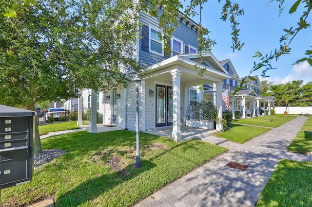 6619 S Manhattan Ave Unit 1, Tampa, FL 33616 - view of front of property with covered porch and a residential view