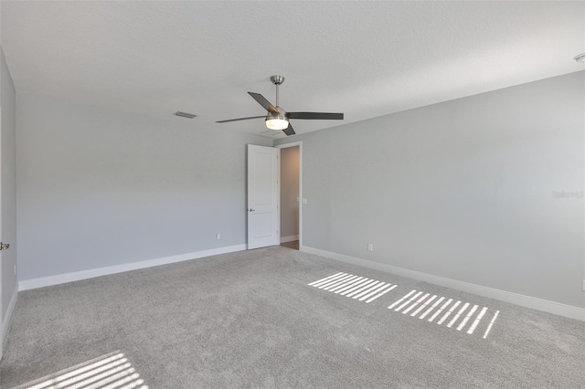 6619 S Manhattan Ave Unit 1, Tampa, FL 33616 - spare room with ceiling fan, carpet floors, baseboards, and a textured ceiling