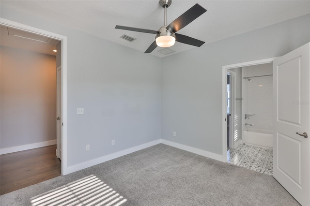 6619 S Manhattan Ave Unit 1, Tampa, FL 33616 - unfurnished bedroom with attic access, carpet, baseboards, ensuite bathroom, and a ceiling fan