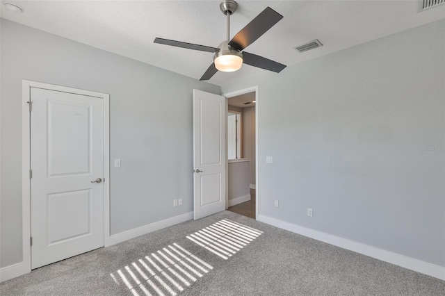 6619 S Manhattan Ave Unit 1, Tampa, FL 33616 - unfurnished bedroom featuring carpet floors, baseboards, and a ceiling fan