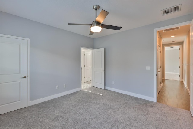 6619 S Manhattan Ave Unit 1, Tampa, FL 33616 - unfurnished bedroom featuring attic access, carpet flooring, baseboards, and ceiling fan