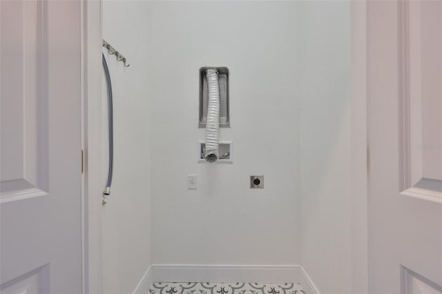 6619 S Manhattan Ave Unit 1, Tampa, FL 33616 - laundry room with hookup for an electric dryer, washer hookup, and baseboards