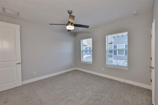 6619 S Manhattan Ave Unit 1, Tampa, FL 33616 - carpeted empty room with a smoke detector, baseboards, and a ceiling fan