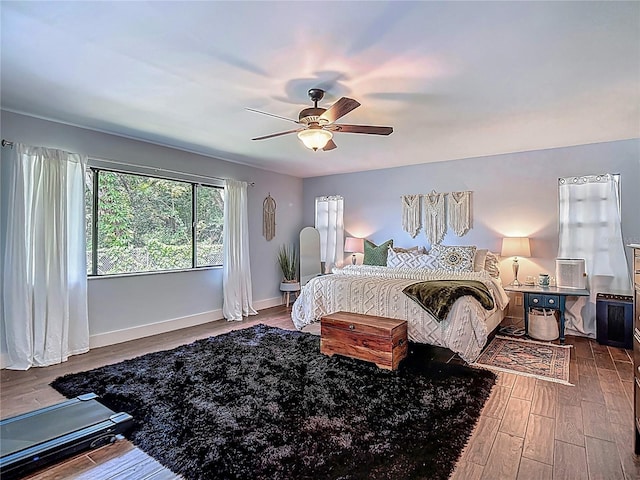1014 Sylvia Ln, Tampa, FL 33613 - bedroom with wood finished floors and a ceiling fan