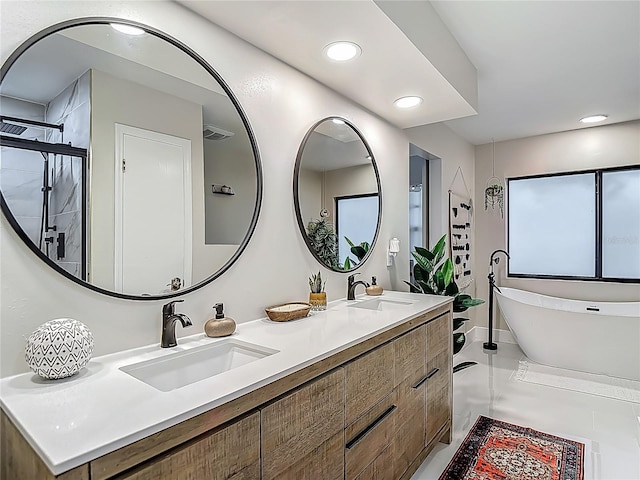 1014 Sylvia Ln, Tampa, FL 33613 - full bath featuring double vanity, a freestanding bath, recessed lighting, and a tile shower
