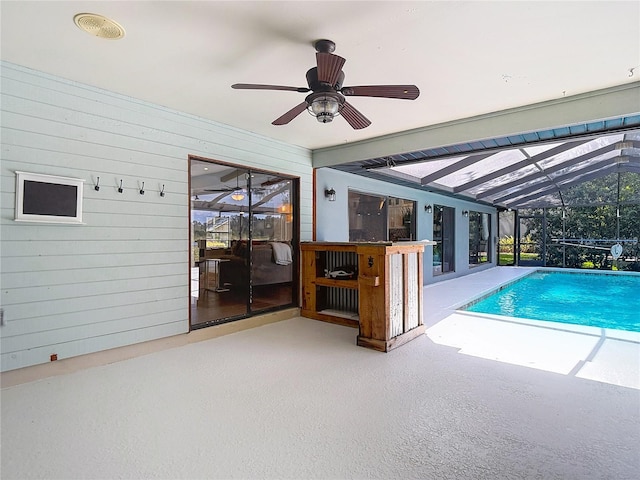 1014 Sylvia Ln, Tampa, FL 33613 - swimming pool with a patio, a ceiling fan, and glass enclosure