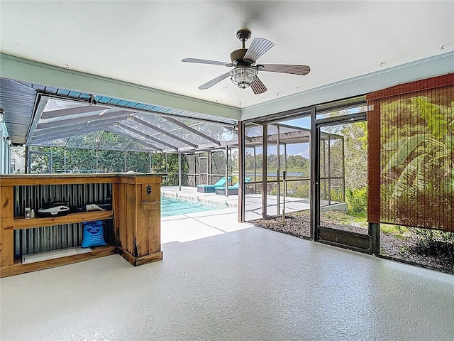 1014 Sylvia Ln, Tampa, FL 33613 - unfurnished sunroom with a ceiling fan and healthy amount of natural light