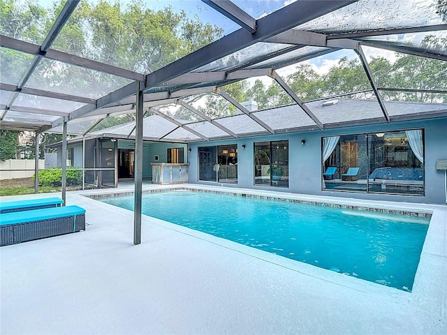 1014 Sylvia Ln, Tampa, FL 33613 - swimming pool with a patio area and glass enclosure