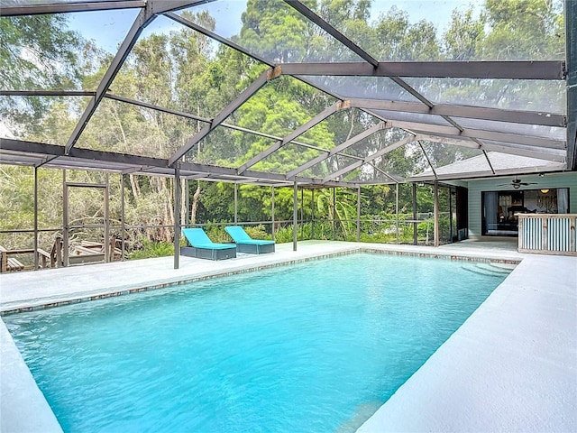 1014 Sylvia Ln, Tampa, FL 33613 - swimming pool featuring a ceiling fan, a patio area, and a lanai