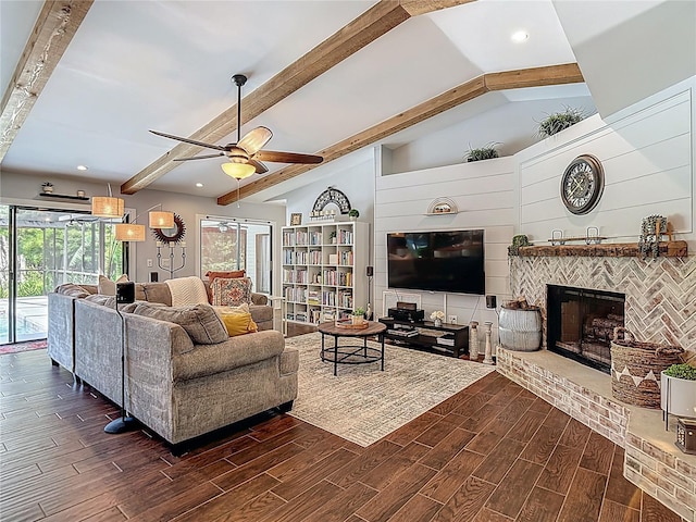 1014 Sylvia Ln, Tampa, FL 33613 - living area featuring dark wood-type flooring, a ceiling fan, recessed lighting, and a fireplace