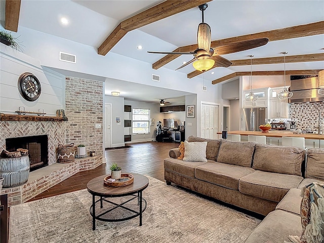 1014 Sylvia Ln, Tampa, FL 33613 - living area with a ceiling fan, wood finished floors, a fireplace, and recessed lighting
