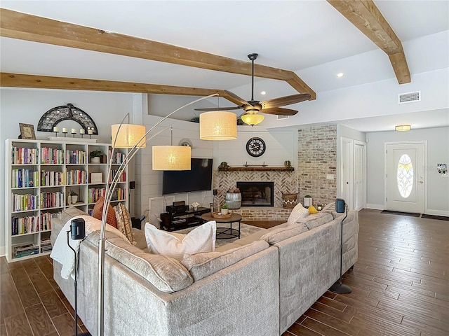 1014 Sylvia Ln, Tampa, FL 33613 - living room with a ceiling fan, dark wood-style floors, beam ceiling, a fireplace, and recessed lighting