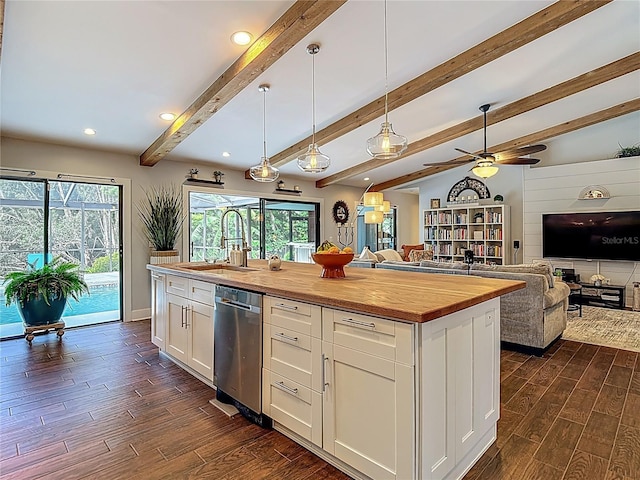 1014 Sylvia Ln, Tampa, FL 33613 - kitchen with butcher block counters, dishwasher, open floor plan, dark wood-style floors, and plenty of natural light