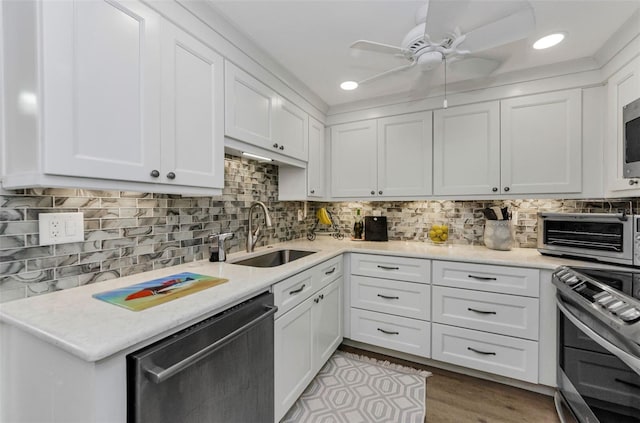 2700 Bayshore Blvd Unit 11405, Dunedin, FL 34698 - kitchen with appliances with stainless steel finishes, a sink, light countertops, recessed lighting, and a ceiling fan
