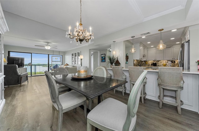 2700 Bayshore Blvd Unit 11405, Dunedin, FL 34698 - dining room with a chandelier, light wood-style flooring, ceiling fan, ornamental molding, and recessed lighting
