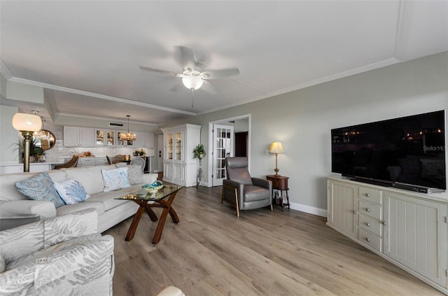 2700 Bayshore Blvd Unit 11405, Dunedin, FL 34698 - living area featuring ceiling fan, light wood-style flooring, ornamental molding, and a chandelier