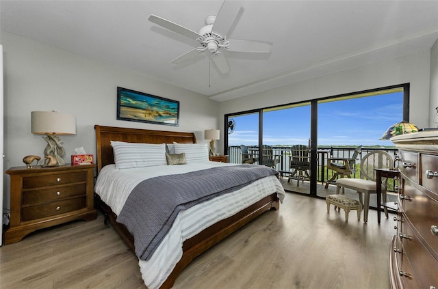 2700 Bayshore Blvd Unit 11405, Dunedin, FL 34698 - bedroom with light wood finished floors, access to exterior, and a ceiling fan