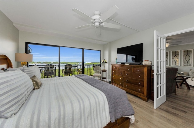 2700 Bayshore Blvd Unit 11405, Dunedin, FL 34698 - bedroom with access to outside, wood finished floors, and a ceiling fan