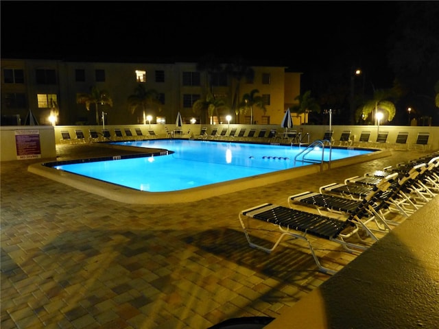 2700 Bayshore Blvd Unit 11405, Dunedin, FL 34698 - pool at twilight with a community pool and a patio