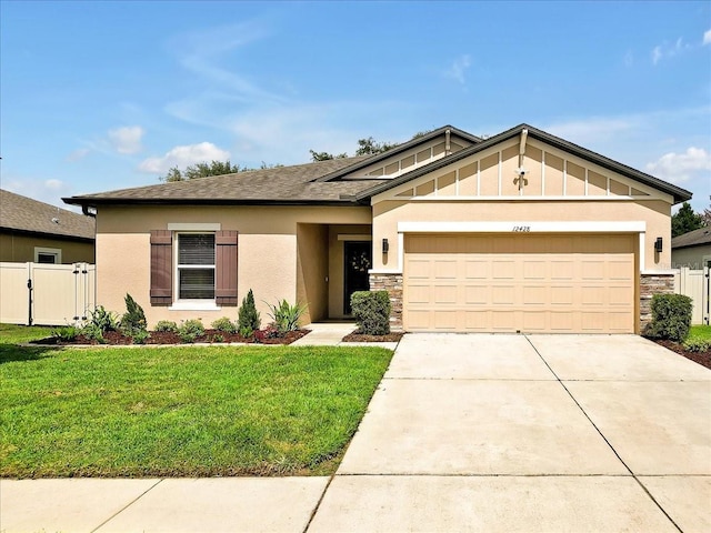 12428 Chaya Ct, Spring Hill, FL 34610 - craftsman-style home with stone siding, an attached garage, concrete driveway, a gate, and stucco siding