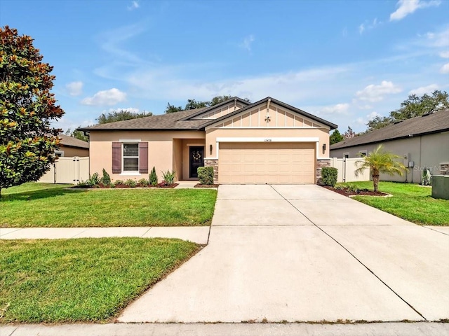 12428 Chaya Ct, Spring Hill, FL 34610 - ranch-style house with an attached garage, driveway, stone siding, board and batten siding, and stucco siding