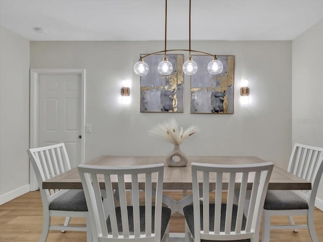12428 Chaya Ct, Spring Hill, FL 34610 - dining room featuring wood finished floors and baseboards