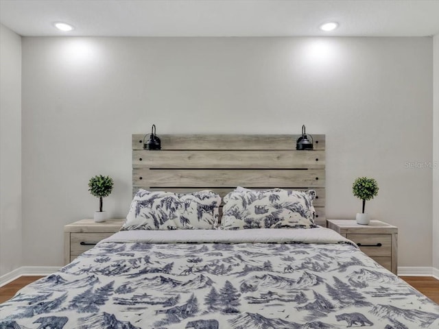 12428 Chaya Ct, Spring Hill, FL 34610 - bedroom with dark wood-style flooring, baseboards, and recessed lighting