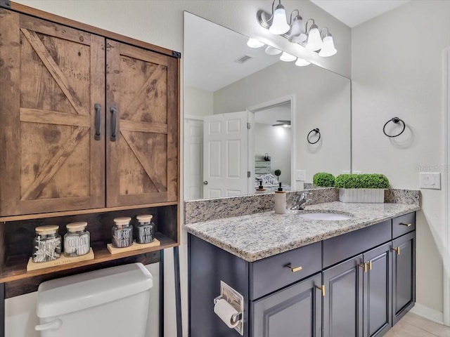 12428 Chaya Ct, Spring Hill, FL 34610 - bathroom with vanity, toilet, and baseboards