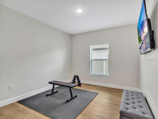 12428 Chaya Ct, Spring Hill, FL 34610 - exercise room with baseboards, wood finished floors, and recessed lighting