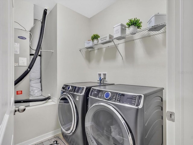 12428 Chaya Ct, Spring Hill, FL 34610 - laundry room featuring independent washer and dryer and baseboards