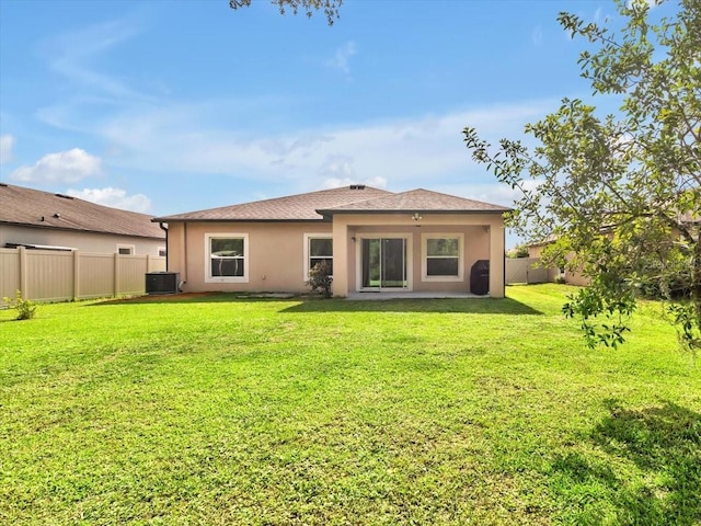 12428 Chaya Ct, Spring Hill, FL 34610 - back of property featuring central AC, stucco siding, and a patio area