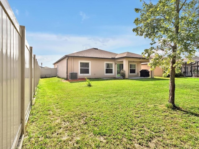 12428 Chaya Ct, Spring Hill, FL 34610 - back of house with cooling unit, roof with shingles, and stucco siding
