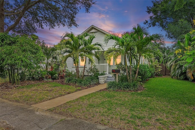 1211 14th St N, Saint Petersburg, FL 33705 - view of property hidden behind natural elements featuring covered porch