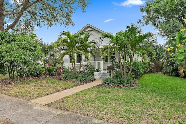 1211 14th St N, Saint Petersburg, FL 33705 - obstructed view of property featuring covered porch