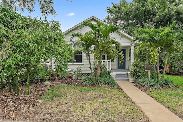 1211 14th St N, Saint Petersburg, FL 33705 - obstructed view of property with a porch
